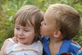 Boy kisses girl Royalty Free Stock Photo