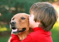 Boy Kissing Dog Royalty Free Stock Photo