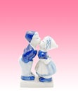 Boy Kissing Girl Porcelain Figure on Pink Background, Clipping P Royalty Free Stock Photo