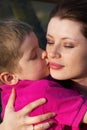 Boy kissing his mother Royalty Free Stock Photo