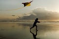 Boy with Kite at sunset.