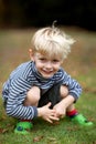 Boy kneeling Royalty Free Stock Photo