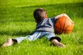 Boy laid down on the grass Royalty Free Stock Photo