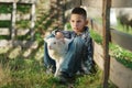 Boy with lamb on the farm Royalty Free Stock Photo