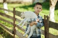 Boy with lamb on the farm Royalty Free Stock Photo