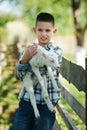 Boy with lamb on the farm Royalty Free Stock Photo