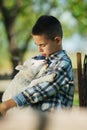 Boy with lamb on the farm Royalty Free Stock Photo