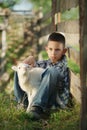 Boy with lamb on the farm Royalty Free Stock Photo