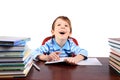 Boy laughing while sitting at the desk