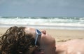 Boy laying on the beach