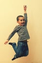 Boy laying in the house. children playing at home. jumping children. vertical photo Royalty Free Stock Photo