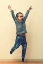 Boy laying in the house. children playing at home. jumping children. vertical photo Royalty Free Stock Photo