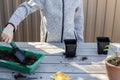 Boy lays the soil with a shovel in seedlings pots for planting plant seeds. spring concept