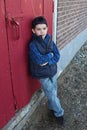 Boy leaning against door Royalty Free Stock Photo