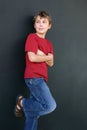 Boy leaning against wall Royalty Free Stock Photo
