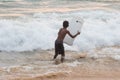 Boy is learning surfing on Indian ocean waves