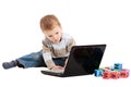 Boy learning to read with kids blocks and computer Royalty Free Stock Photo