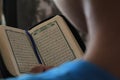 Boy Learning to Read Quran in Arabic Royalty Free Stock Photo