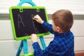 The boy is learning to read and write . The child learns the alphabet Royalty Free Stock Photo