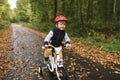 A boy learns riding a four-wheeled bicycle Royalty Free Stock Photo