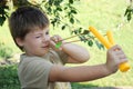 A boy with a left-handed catapult Royalty Free Stock Photo