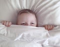 The boy lies in bed relaxation Royalty Free Stock Photo