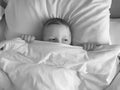 The boy lies in bed relaxation lifestyle Royalty Free Stock Photo