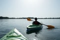 Boy in life jacket on green kayak Royalty Free Stock Photo