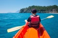 Boy in life jacket on orange kayak Royalty Free Stock Photo