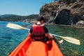 Boy in life jacket on orange kayak Royalty Free Stock Photo