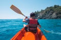 Boy in life jacket on orange kayak Royalty Free Stock Photo