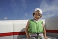 Boy In Life Jacket Sitting On Yacht Royalty Free Stock Photo