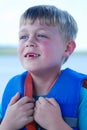 Boy in lifejacket missing front teet Royalty Free Stock Photo