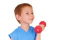 Boy lifting dumbbell Royalty Free Stock Photo