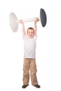 Boy lifts stool Royalty Free Stock Photo