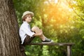 Boy in the light hat is sitting Royalty Free Stock Photo