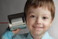 Boy listen tin can telephone Royalty Free Stock Photo