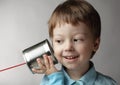 Boy listen tin can telephone Royalty Free Stock Photo