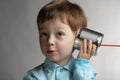 Boy listen tin can telephone Royalty Free Stock Photo