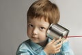 Boy listen tin can telephone Royalty Free Stock Photo
