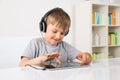 Boy Listening Music On Digital Tablet Royalty Free Stock Photo