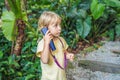 Boy listens to a radio guide, tourism concept Royalty Free Stock Photo