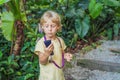 Boy listens to a radio guide, tourism concept Royalty Free Stock Photo