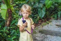 Boy listens to a radio guide, tourism concept Royalty Free Stock Photo