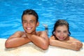 Boy and little girl summer vacation in pool Royalty Free Stock Photo