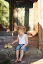 Boy with little yellow duckling in summer village Royalty Free Stock Photo