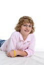 Boy with long blonde hair and a pink shirt