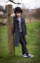 Boy in Long Coat and Top Hat Royalty Free Stock Photo