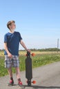 Boy with longboard Royalty Free Stock Photo