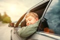 Boy look out from the car window Royalty Free Stock Photo